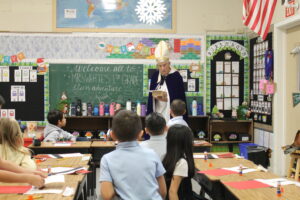 Photo of Bishop Vasa visiting our grade 1 classroom.